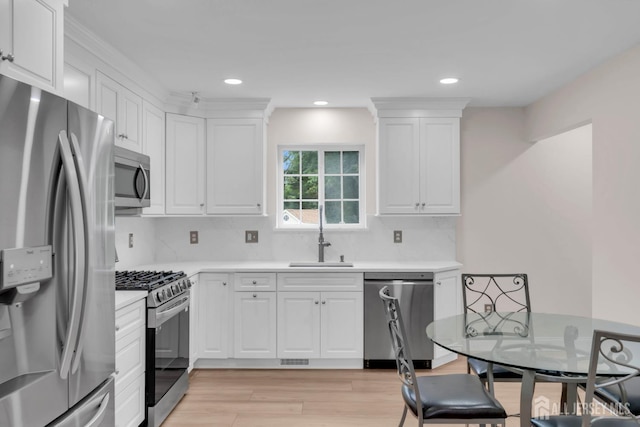 3 Malibu Ct, Jackson, NJ 08527 - kitchen featuring appliances with stainless steel finishes, white cabinetry, light countertops, light wood-style flooring, and recessed lighting