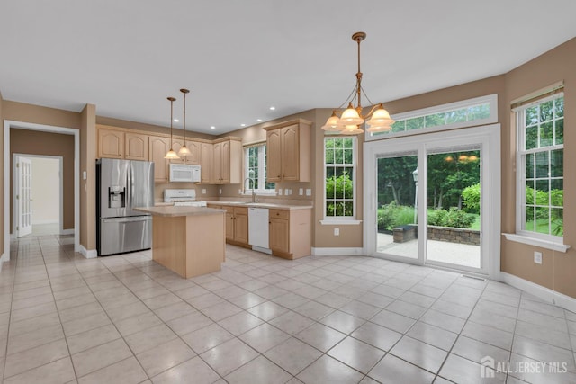 3 Malibu Ct, Jackson, NJ 08527 - kitchen featuring white appliances, light countertops, light brown cabinetry, a chandelier, and a center island