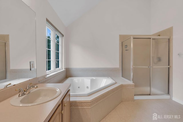 3 Malibu Ct, Jackson, NJ 08527 - bathroom with vanity, a jetted tub, vaulted ceiling, tile patterned flooring, and a stall shower