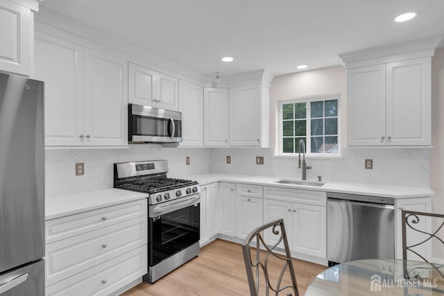 3 Malibu Ct, Jackson, NJ 08527 - kitchen featuring appliances with stainless steel finishes, tasteful backsplash, white cabinets, and recessed lighting