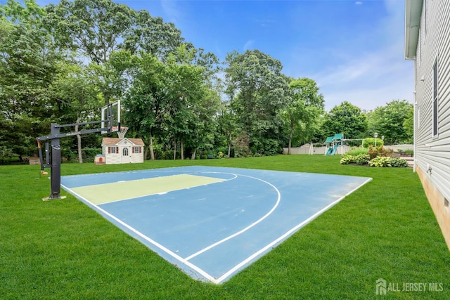 3 Malibu Ct, Jackson, NJ 08527 - view of sport court with a playground, a lawn, basketball hoop, and view of wooded area