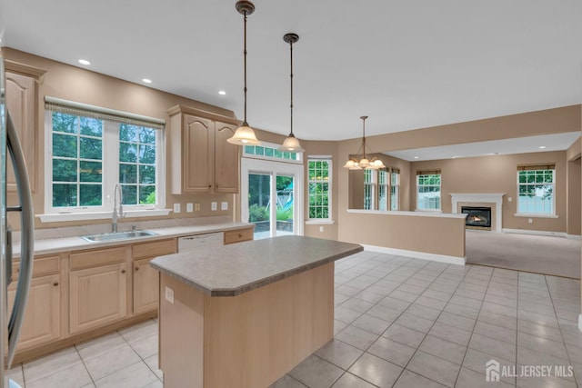 3 Malibu Ct, Jackson, NJ 08527 - kitchen with light brown cabinetry, a glass covered fireplace, a kitchen island, a chandelier, and recessed lighting