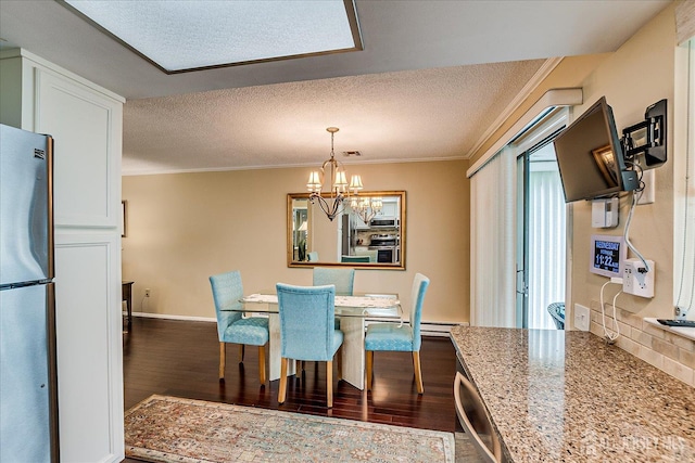 106-B Hemlock Plz, Monroe, NJ 08831 - dining area featuring crown molding, dark wood-style floors, a chandelier, and a textured ceiling