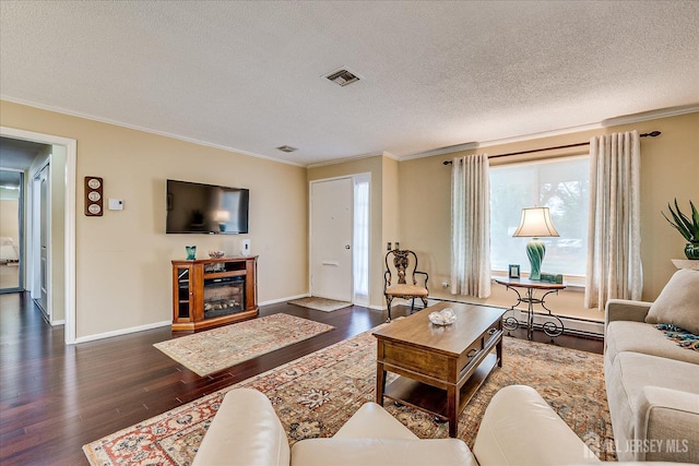 106-B Hemlock Plz, Monroe, NJ 08831 - living room with crown molding, dark wood finished floors, a textured ceiling, baseboard heating, and a glass covered fireplace