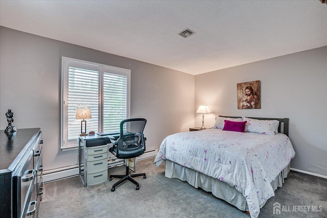 106-B Hemlock Plz, Monroe, NJ 08831 - carpeted bedroom with a baseboard heating unit and a desk