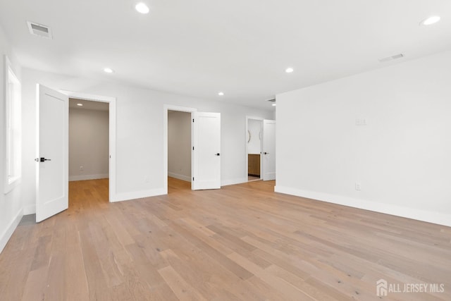 spare room with light hardwood / wood-style floors