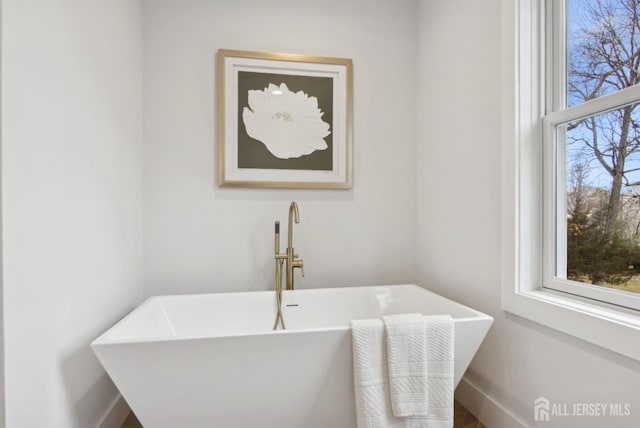 bathroom with sink and a bath