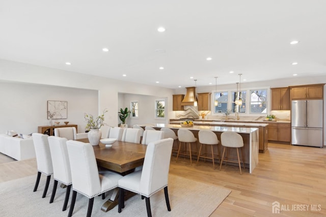 dining space with light hardwood / wood-style flooring