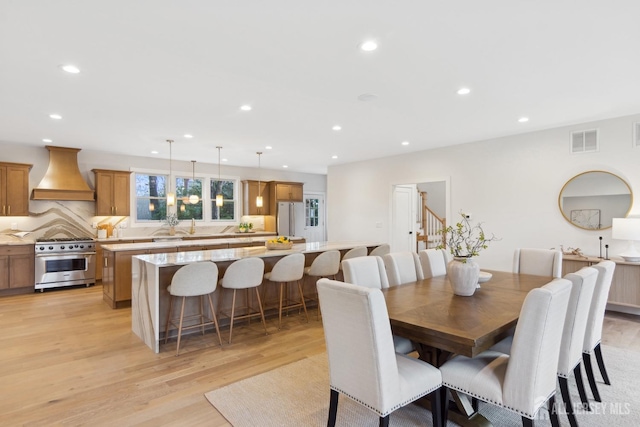 dining room featuring light wood-type flooring