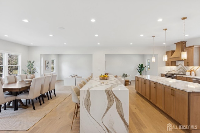 dining space featuring light wood-type flooring