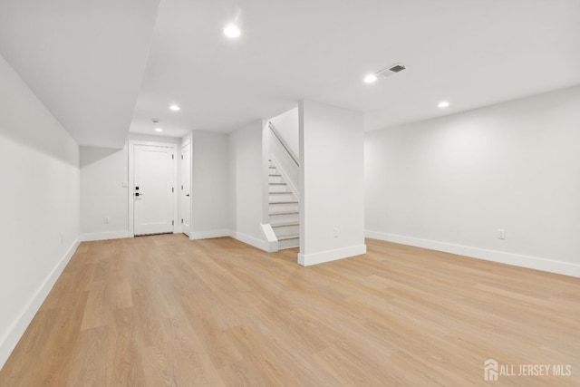 basement featuring light wood-type flooring