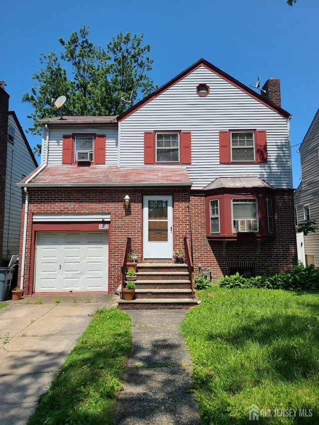 1472 Stanley Ter, Hillside, NJ 07205 - view of front of home featuring brick siding, driveway, and a chimney