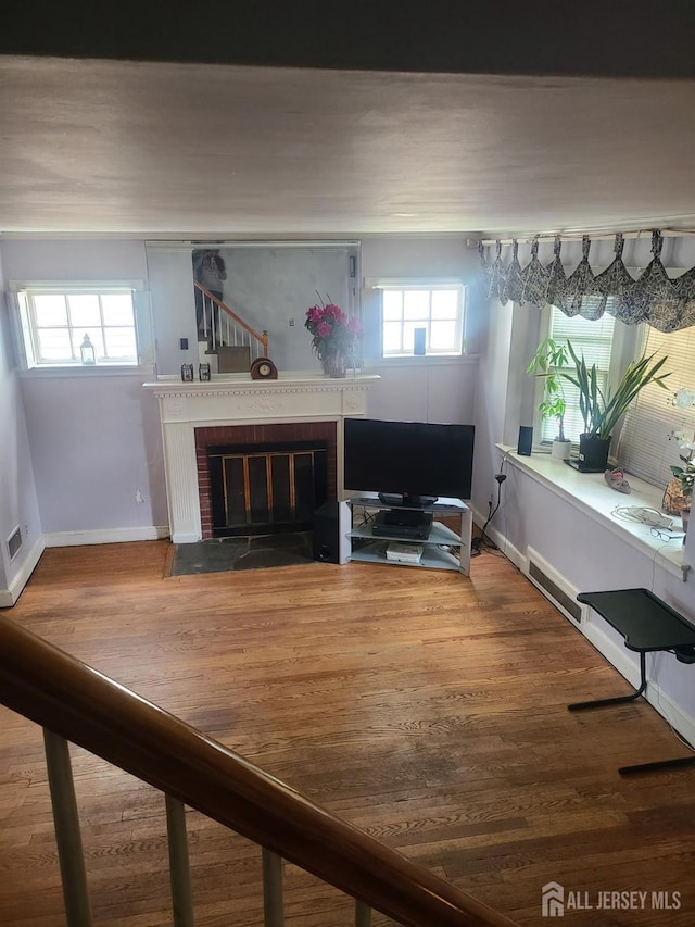 1472 Stanley Ter, Hillside, NJ 07205 - living room featuring a brick fireplace and wood finished floors