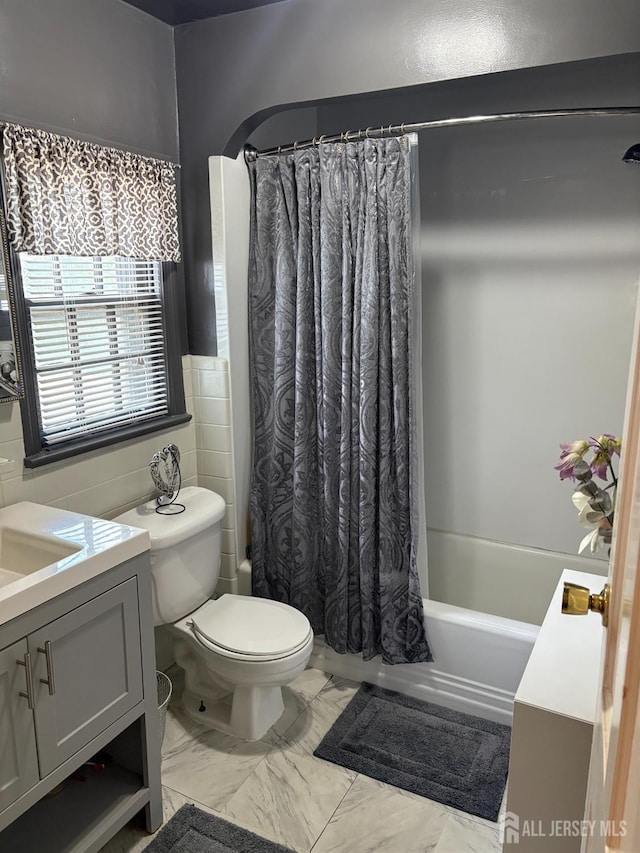 1472 Stanley Ter, Hillside, NJ 07205 - bathroom with vanity, shower / bath combination with curtain, marble look tiles, and tile walls