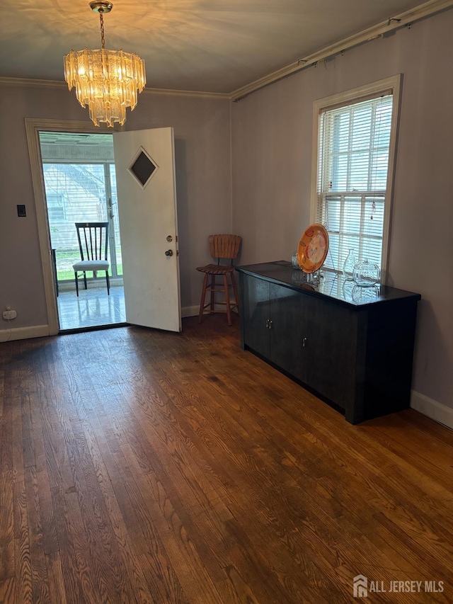 1472 Stanley Ter, Hillside, NJ 07205 - dining space featuring a chandelier, crown molding, and dark wood-style flooring