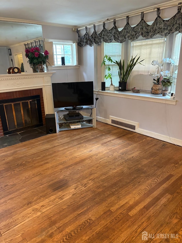 1472 Stanley Ter, Hillside, NJ 07205 - living room featuring crown molding, wood finished floors, and a brick fireplace