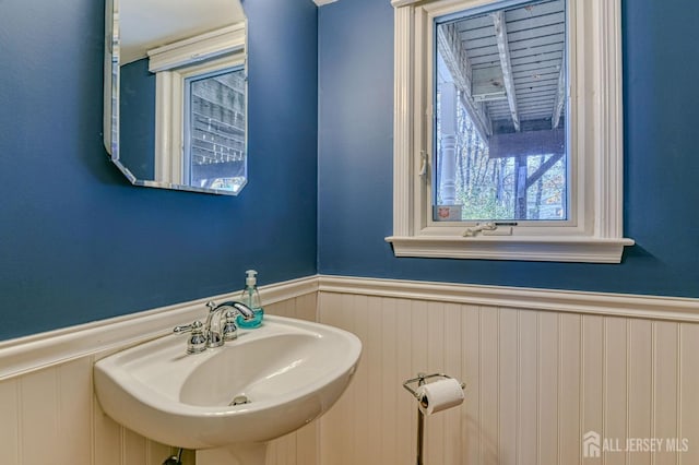 bathroom featuring a sink and wainscoting