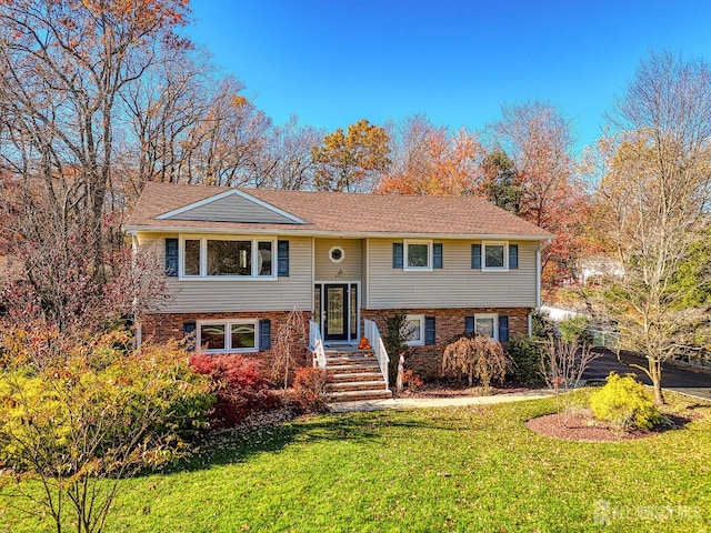 bi-level home with a front yard