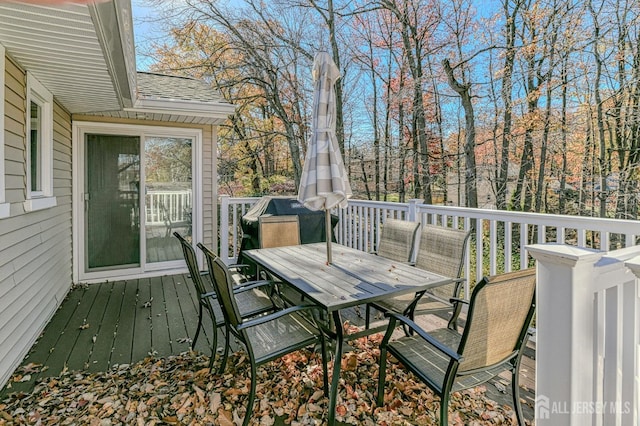 wooden deck with outdoor dining area