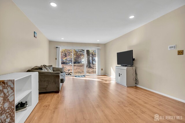 living room with light hardwood / wood-style flooring