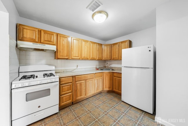227 College Dr, Edison, NJ 08817 - kitchen featuring white appliances, under cabinet range hood, light countertops, and tasteful backsplash
