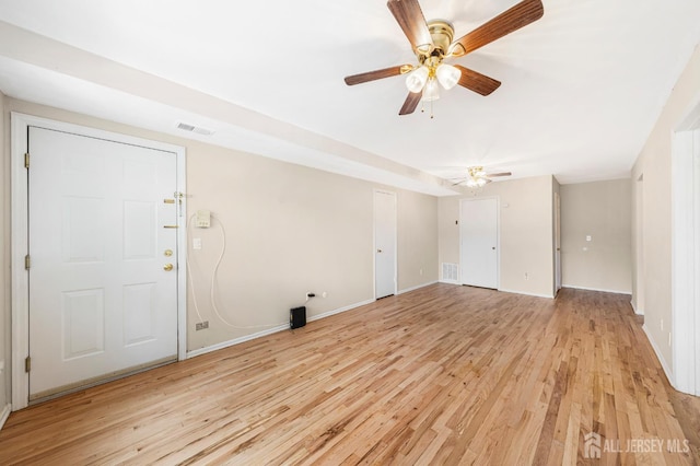227 College Dr, Edison, NJ 08817 - unfurnished living room featuring light wood-type flooring and a ceiling fan