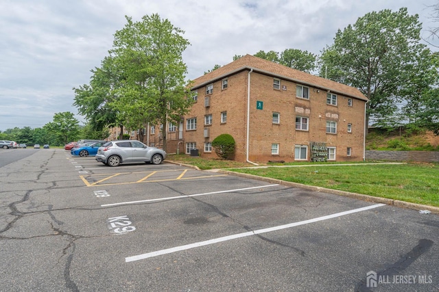 227 College Dr, Edison, NJ 08817 - view of property featuring uncovered parking