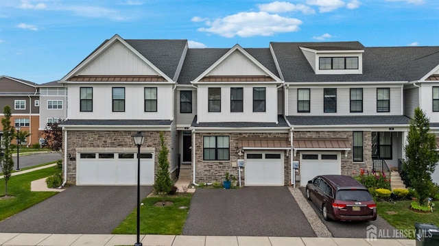 30 Clover Ln, Monroe, NJ 08831 - multi unit property featuring stone siding, driveway, an attached garage, and board and batten siding