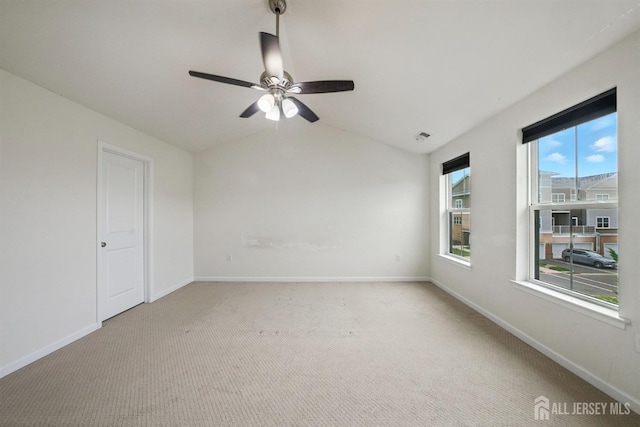 30 Clover Ln, Monroe, NJ 08831 - spare room with a ceiling fan, light carpet, and vaulted ceiling