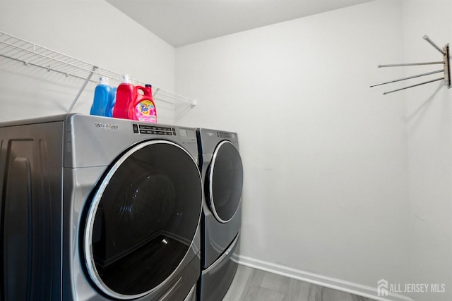 30 Clover Ln, Monroe, NJ 08831 - laundry room featuring separate washer and dryer and wood finished floors