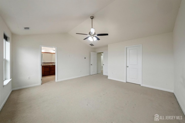 30 Clover Ln, Monroe, NJ 08831 - unfurnished bedroom with light carpet, lofted ceiling, connected bathroom, and a ceiling fan