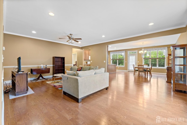 72 Wintergreen Dr, Manalapan, NJ 07726 - living area featuring a chandelier, light wood finished floors, crown molding, baseboards, and recessed lighting