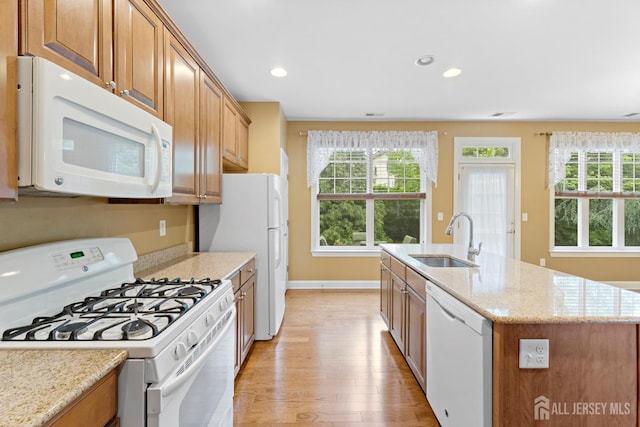 72 Wintergreen Dr, Manalapan, NJ 07726 - kitchen with white appliances, a sink, light wood finished floors, plenty of natural light, and recessed lighting