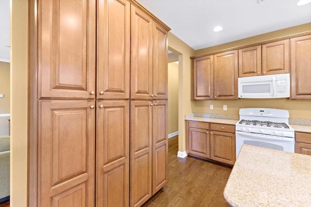 72 Wintergreen Dr, Manalapan, NJ 07726 - kitchen featuring white appliances, wood finished floors, light countertops, baseboards, and recessed lighting