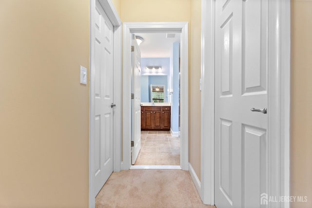 72 Wintergreen Dr, Manalapan, NJ 07726 - hallway with light carpet and baseboards