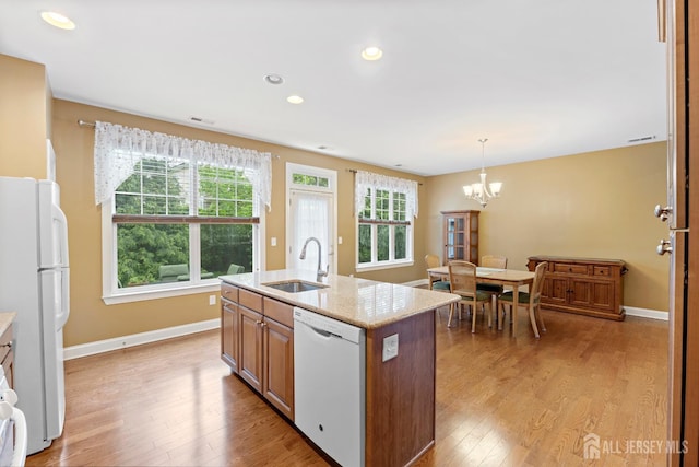 72 Wintergreen Dr, Manalapan, NJ 07726 - kitchen with white appliances, a sink, light wood finished floors, healthy amount of natural light, and recessed lighting