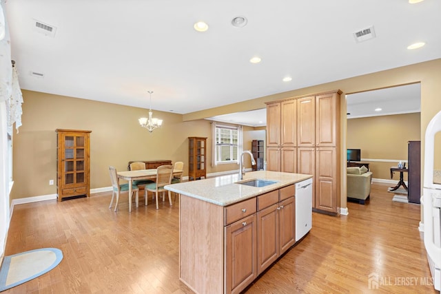 72 Wintergreen Dr, Manalapan, NJ 07726 - kitchen with light wood-style flooring, white dishwasher, a sink, a center island with sink, and recessed lighting