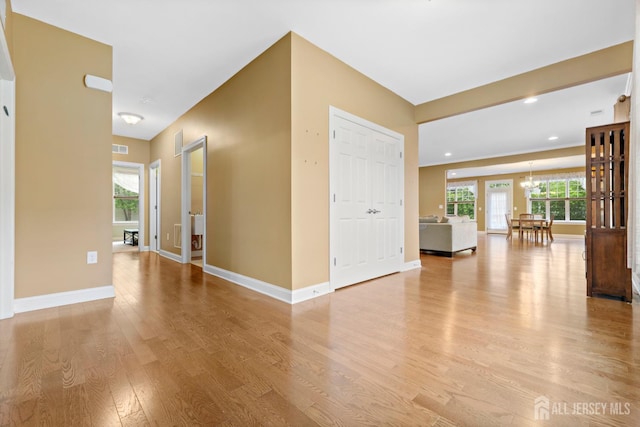 72 Wintergreen Dr, Manalapan, NJ 07726 - spare room featuring light wood finished floors, a chandelier, baseboards, healthy amount of natural light, and recessed lighting