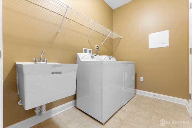 72 Wintergreen Dr, Manalapan, NJ 07726 - laundry area with washing machine and dryer, baseboards, and tile patterned flooring