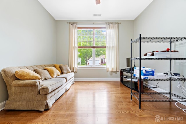 72 Wintergreen Dr, Manalapan, NJ 07726 - living area featuring wood finished floors, baseboards, and ceiling fan