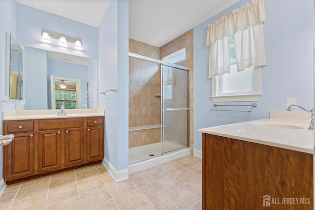 72 Wintergreen Dr, Manalapan, NJ 07726 - bathroom with vanity, a stall shower, baseboards, and tile patterned flooring