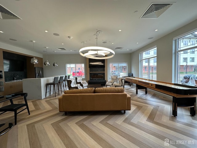 interior space with recessed lighting, visible vents, and a sink