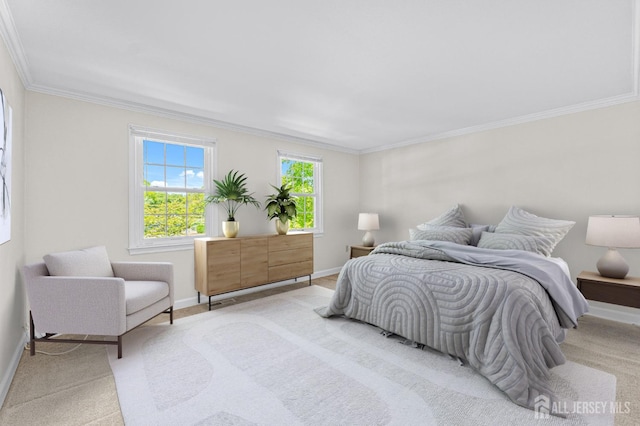 carpeted bedroom with ornamental molding and baseboards