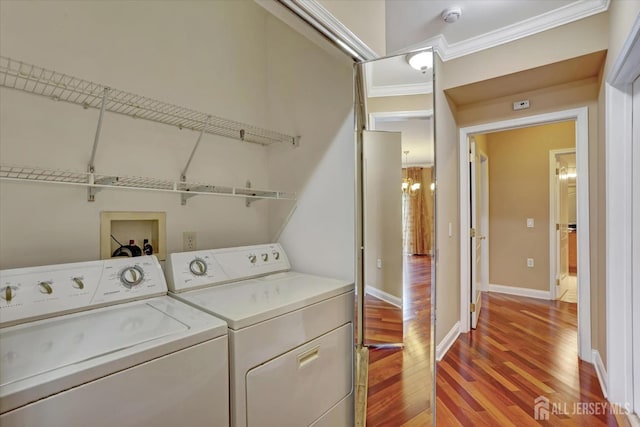 4215 Falston Cir Unit 15, Old Bridge, NJ 08857 - laundry room with crown molding, light wood finished floors, washing machine and clothes dryer, and a chandelier
