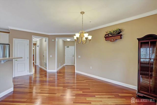 4215 Falston Cir Unit 15, Old Bridge, NJ 08857 - unfurnished dining area featuring a chandelier, light wood-style floors, and ornamental molding