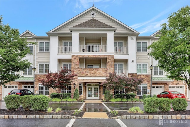 4215 Falston Cir Unit 15, Old Bridge, NJ 08857 - view of front of home with french doors, stone siding, and a garage