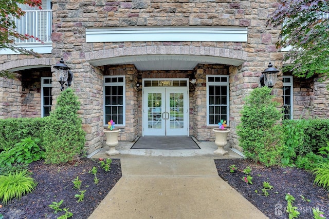 4215 Falston Cir Unit 15, Old Bridge, NJ 08857 - view of exterior entry featuring french doors, a balcony, and stone siding