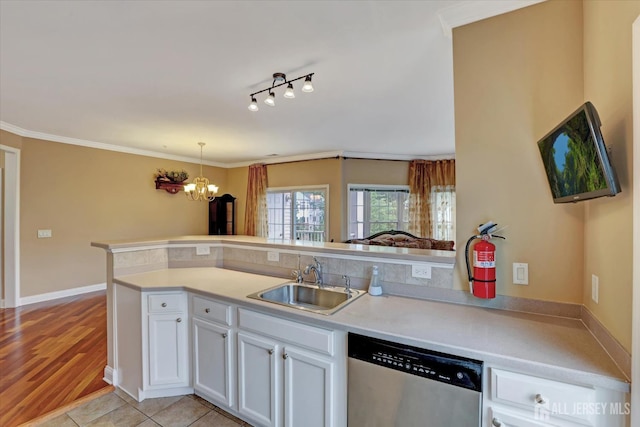 4215 Falston Cir Unit 15, Old Bridge, NJ 08857 - kitchen with stainless steel dishwasher, white cabinets, a chandelier, light countertops, and ornamental molding