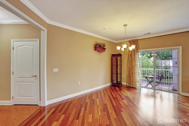 4215 Falston Cir Unit 15, Old Bridge, NJ 08857 - unfurnished room with a chandelier, wood finished floors, and ornamental molding