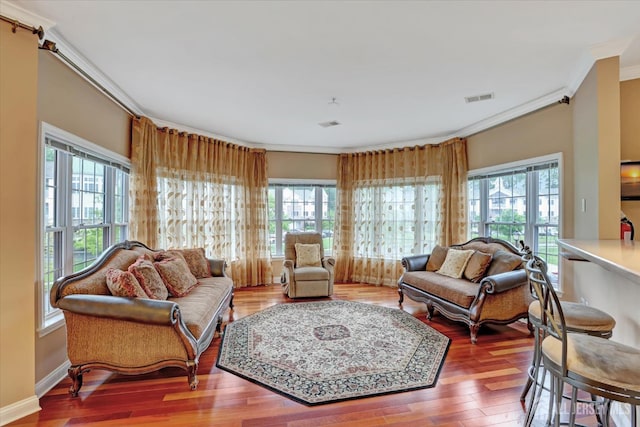 4215 Falston Cir Unit 15, Old Bridge, NJ 08857 - living area with ornamental molding, healthy amount of natural light, and wood finished floors